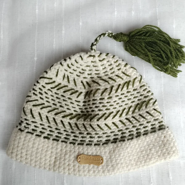 Hand-knitted tassle hat